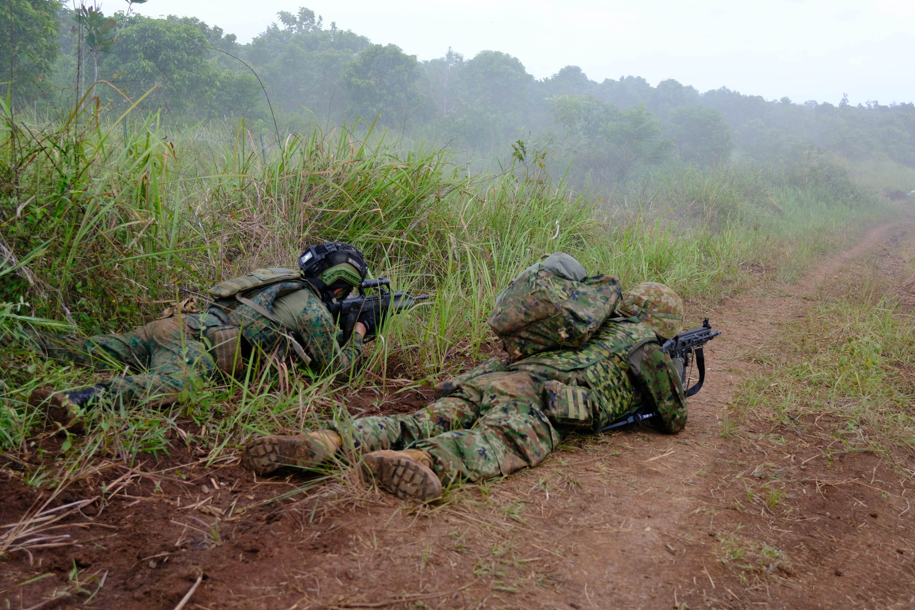 A serviceman from the Singapore Army participating in the Combined Arms Live Firing Exercise alongside soldiers from par